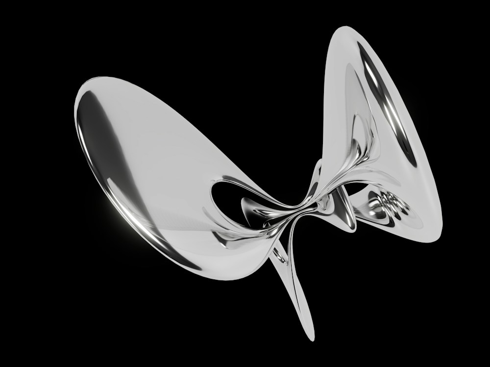 A fluid chrome form with sculptural curves and polished reflections on black.