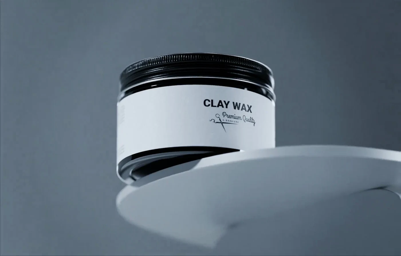 Il Barbiere Clay Wax jar levitating above a grey sculptural platform