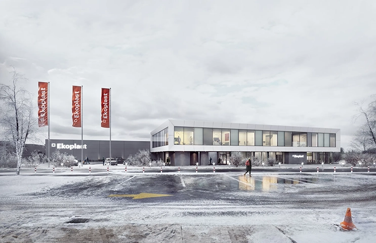 Contemporary commercial showroom beside a snowy road under an overcast sky